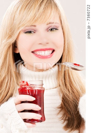 happy teenage girl with raspberry jam 7360722