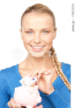 lovely woman with piggy bank and money 7361353