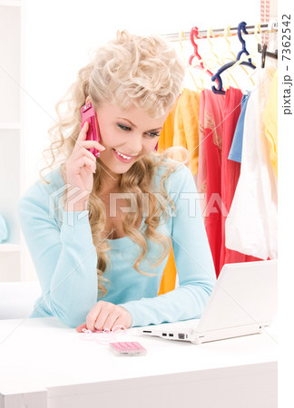 lovely woman with cell phone and computer lovely woman with cell phone and computer 7362542