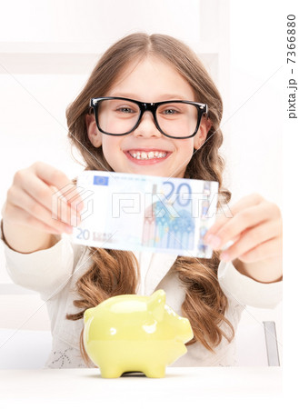 little girl with piggy bank and money little girl with piggy bank and money 7366880