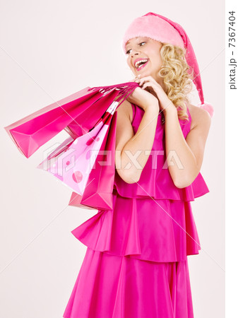 cheerful santa helper girl with shopping bags 7367404