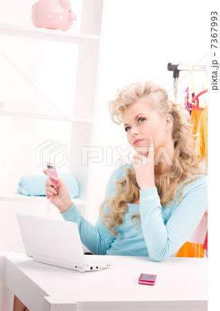 lovely woman with calculator and computer lovely woman with calculator and computer 7367993