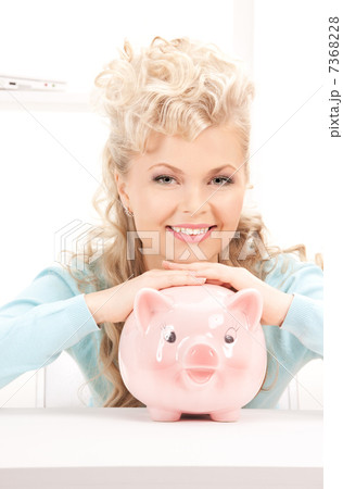 lovely woman with piggy bank 7368228