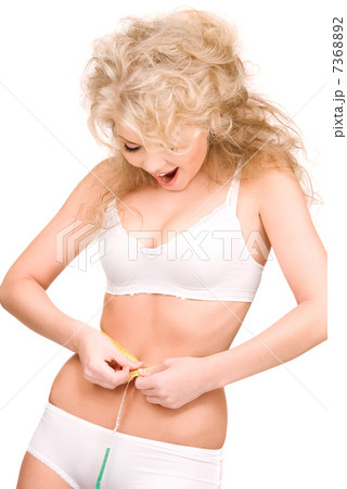 young beautiful woman with measure tape 7368892