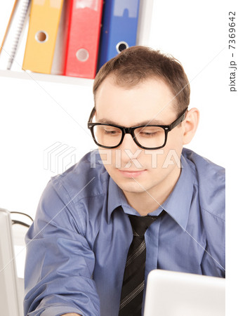 businessman with laptop computer in office 7369642