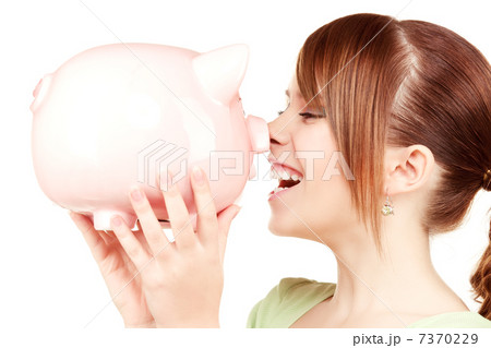 lovely teenage girl with piggy bank 7370229