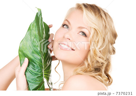 woman with green leaf 7370231