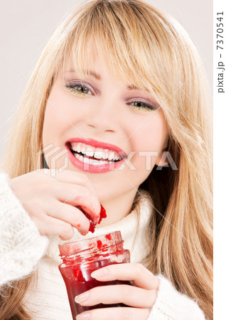 happy teenage girl with raspberry jam 7370541
