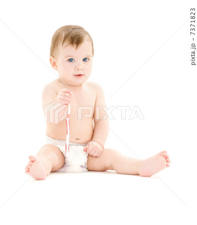baby boy in diaper with toothbrush 7371823