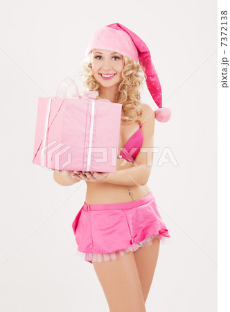 cheerful santa helper girl with gift box cheerful santa helper girl with gift box 7372138
