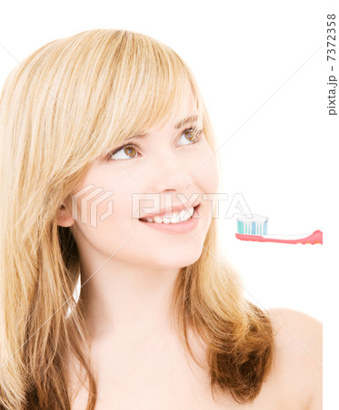 happy girl with toothbrush 7372358