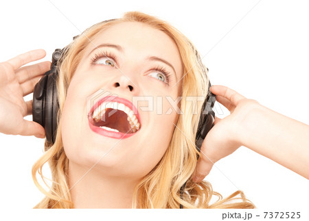 happy woman in headphones 7372525