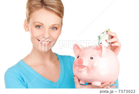 lovely woman with piggy bank and money 7373022