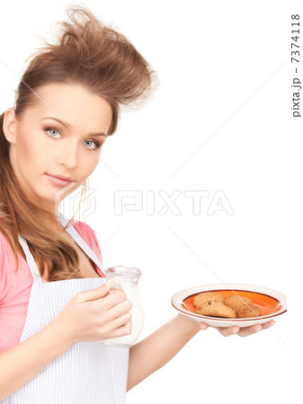 housewife with milk and cookies housewife with milk and cookies 7374118