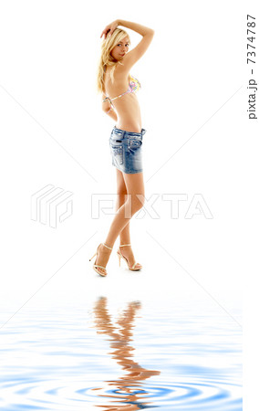blond in denim skirt and bikini on white sand blond in denim skirt and bikini on white sand 7374787