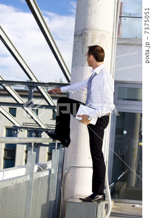 handsome businessman with laptop computer on a building site 7375051