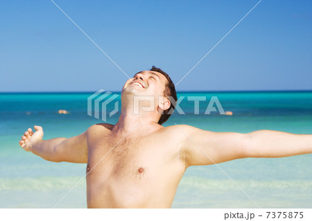 happy man on the beach happy man on the beach 7375875