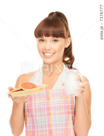 housewife with milk and cookies 7376777