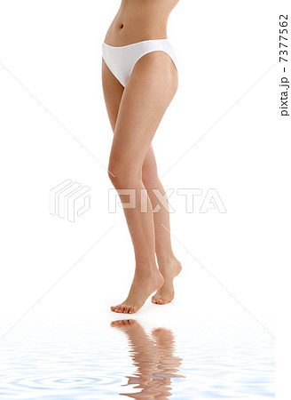 long legs in bikini panties on white sand 7377562