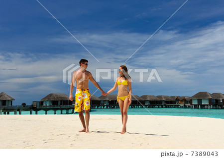 Couple on a beach at Maldives Couple on a beach at Maldives 7389043
