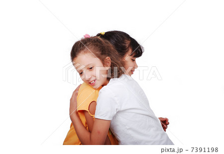Two female friends or sisters hugging eacht other Two female friends or sisters hugging eacht other 7391198