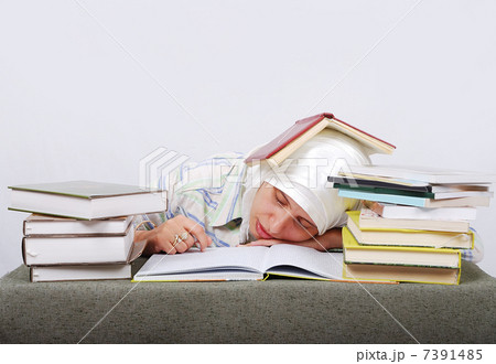 A young muslim woman in traditional clothes in education process 7391485
