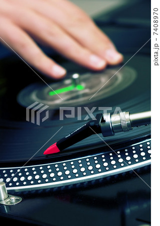 DJ scratching the vinyl record 7408970