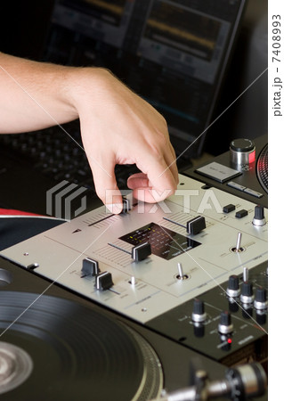 Hand of a dj adjusting the crossfader Hand of a dj adjusting the crossfader 7408993