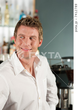 Coffeeshop - barista in his café 7412789