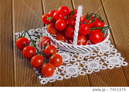 Fresh tomatoes on wooden background Fresh tomatoes on wooden background 7421374