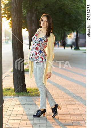Pretty brunette in grey jeans Pretty brunette in grey jeans 7428278