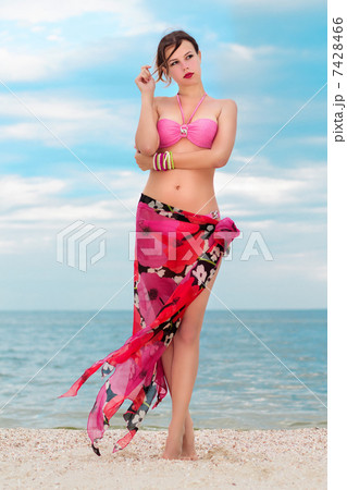 Woman in flowered pareo Woman in flowered pareo 7428466