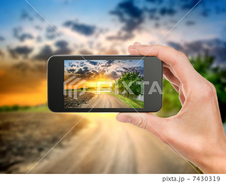 Phone and evening landscape Phone and evening landscape 7430319