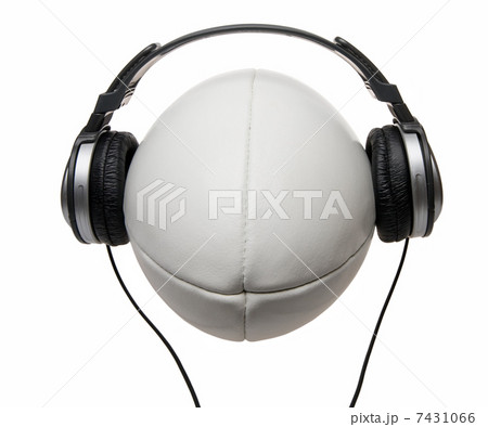 Headphones on smiling rugby ball 7431066