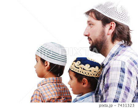 Muslim family, father and two boys 7431323