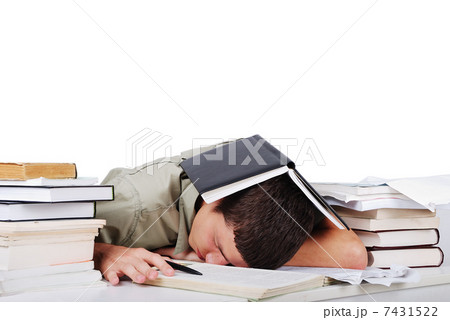 Young man fallen asleep after long reading 7431522