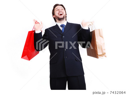 Young attractive man wearing suit and holding shopping bags 7432064