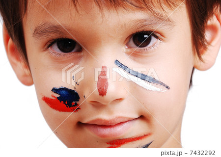 Little cute kid with colors on his face 7432292