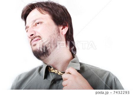 Man wearing shirt and tie with boring expression on his face 7432293
