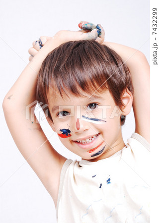 Little cute kid with colors on his face 7432299