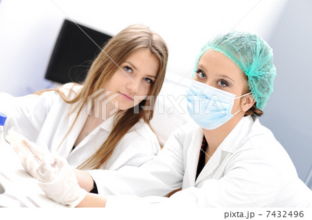 Inside the modern lab of university hospital, young confidental successful doctors and scientists 7432496