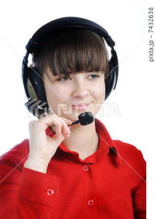 Portrait of a beautiful young lady with headset isolated on white background Portrait of a beautiful young lady with headset isolated on white background 7432638