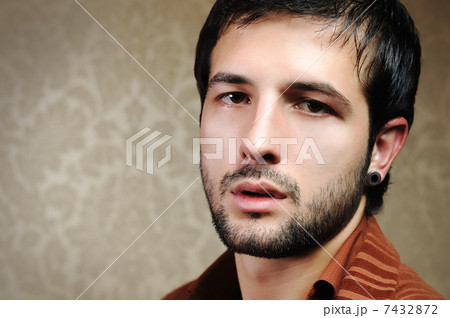 Young fashionable stylish man with a short beard posing Young fashionable stylish man with a short beard posing 7432872