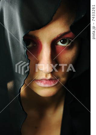 very pretty woman with dark neckerchief on head, sensual sexuality gaze 7433261