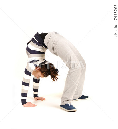 Beautiful young woman makes stretching isolated over white background Beautiful young woman makes stretching isolated over white background 7433268