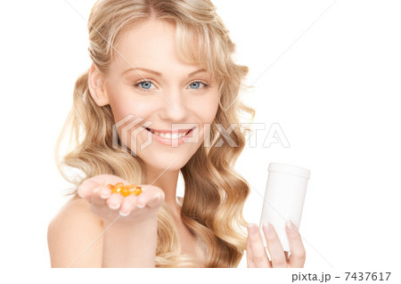young woman with pills 7437617