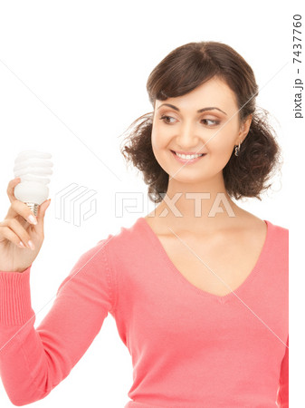woman holding energy saving bulb 7437760