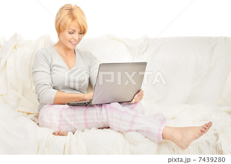happy woman with laptop computer 7439280