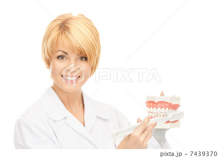 doctor with toothbrush and jaws 7439370