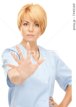 attractive female doctor showing stop gesture attractive female doctor showing stop gesture 7440169